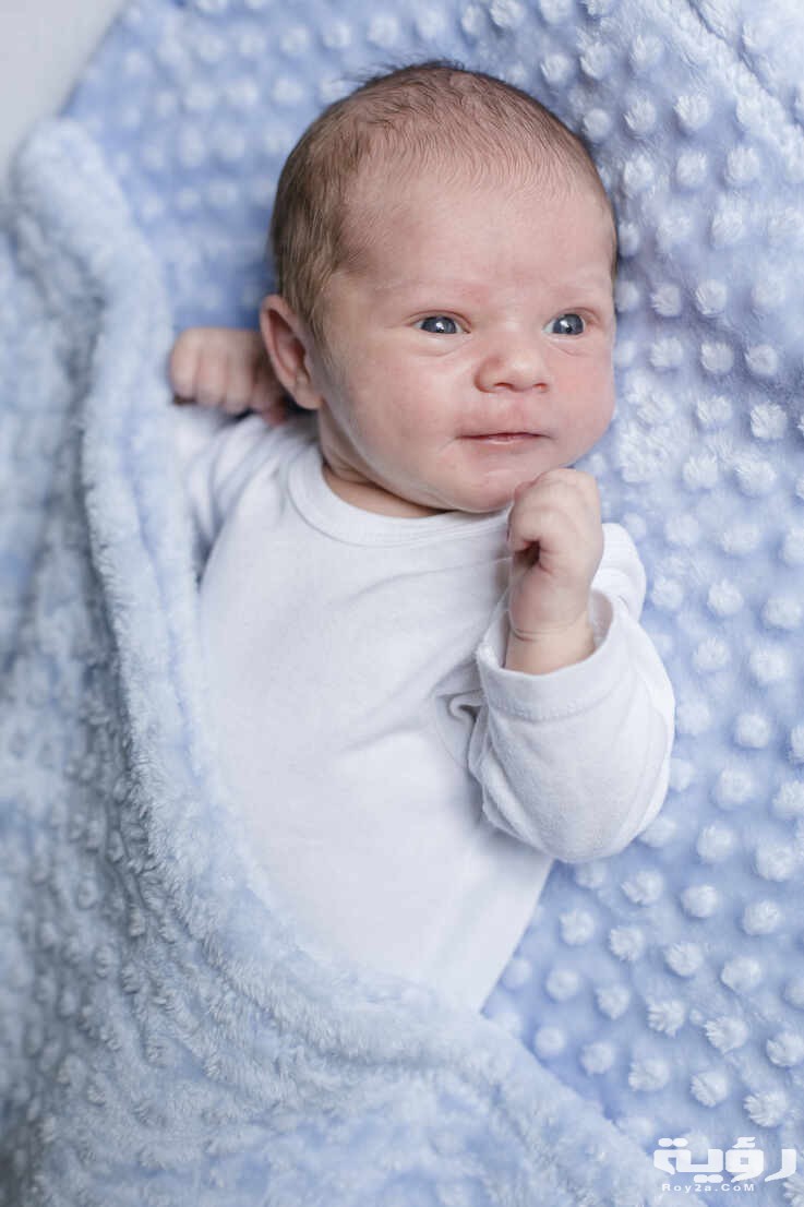 اسماء اولاد بحرف ط الطاء 2026 ومعانيها 2 portrait of a newborn baby boy lying on a blanket STBF00369